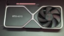 An Nvidia GeForce RTX 4070 Founders Edition graphics card against a black background